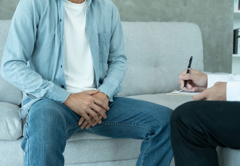 Man-with-groin-discomfort-consulting-doctor